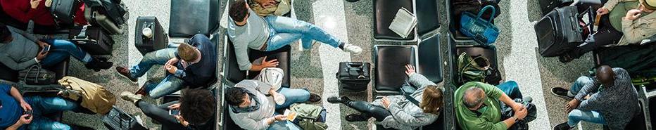 People in a airport gate area, lounging